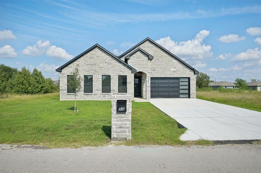Front exterior of a new home in , Gun Barrel City, TX, highlighting curb appeal (Image 22). Front exterior of a new home in , Gun Barrel City, TX, highlighting curb appeal (Image 22).