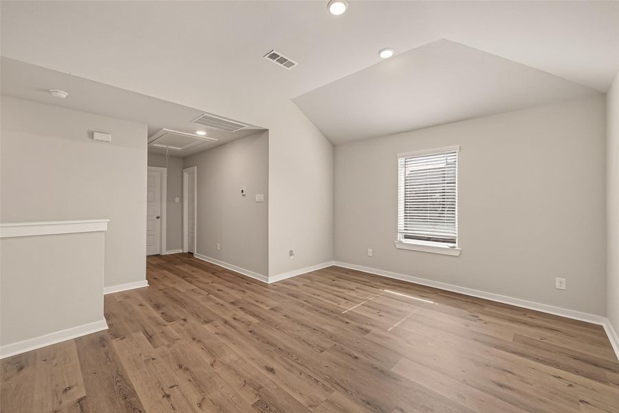 An upstairs game room provides additional living space with plenty of room for recreation, entertainment, or a home retreat. An upstairs game room provides additional living space with plenty of room for recreation, entertainment, or a home retreat.