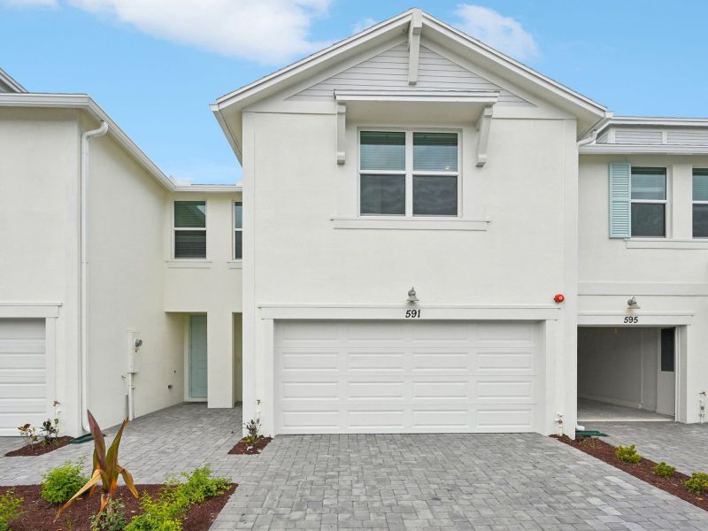 Front exterior of a new home in Tidewater, Fort Pierce, FL, highlighting curb appeal (Image 1). Front exterior of a new home in Tidewater, Fort Pierce, FL, highlighting curb appeal (Image 1).