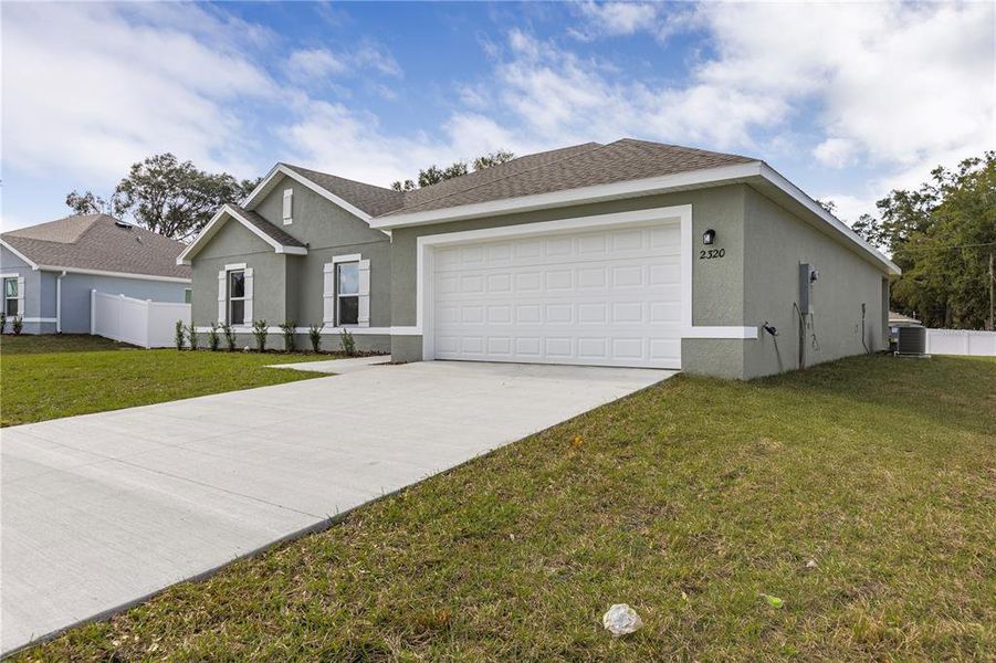 Front exterior of a new home in Sable Run, Ocala, FL, highlighting curb appeal (Image 7).