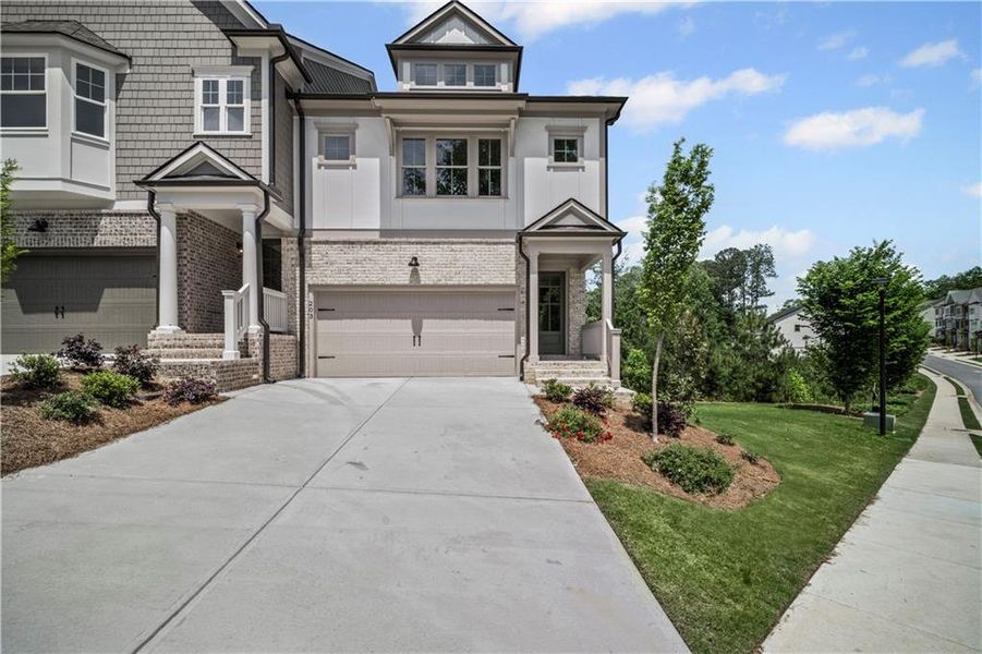 Front exterior of a new home in The Retreat at River Green, Canton, GA, highlighting curb appeal (Image 21).