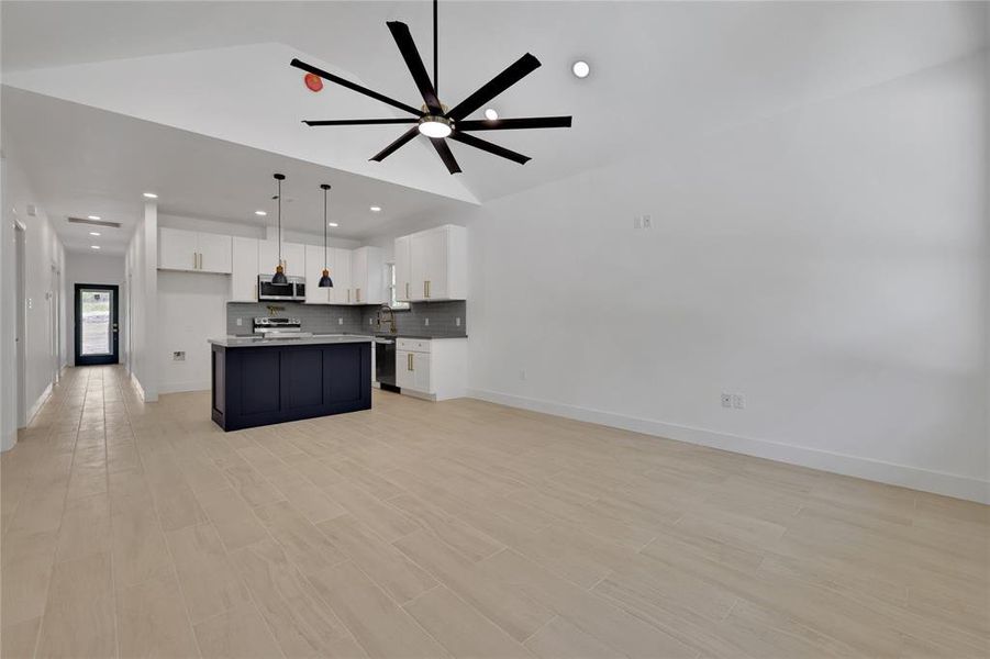 The home has neutral tile flooring throughout the main living areas of the home