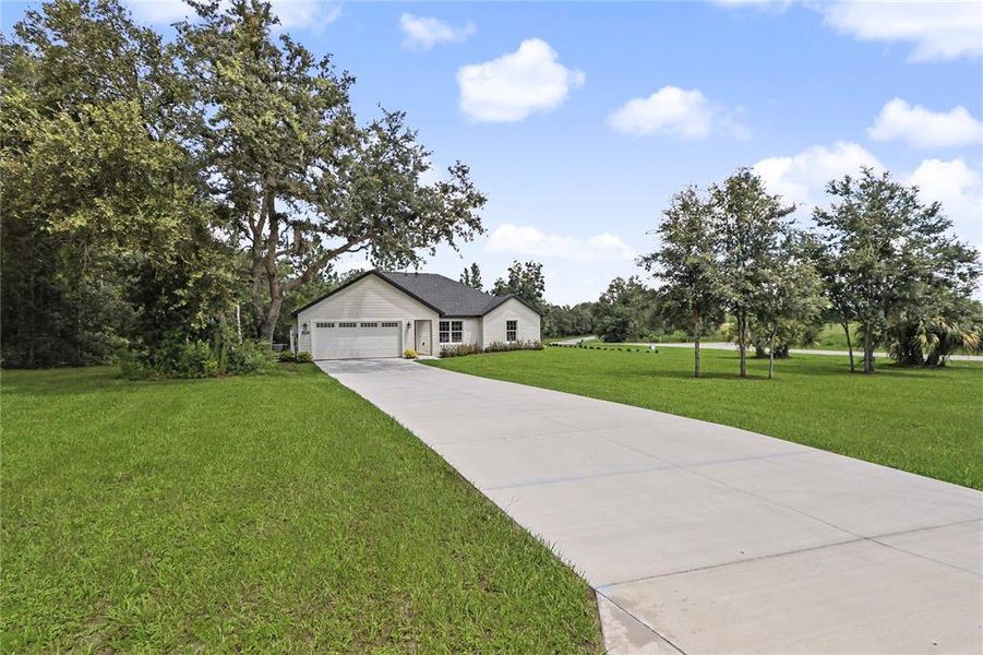 Front exterior of a new home in , Dunnellon, FL, highlighting curb appeal (Image 2). Front exterior of a new home in , Dunnellon, FL, highlighting curb appeal (Image 2).