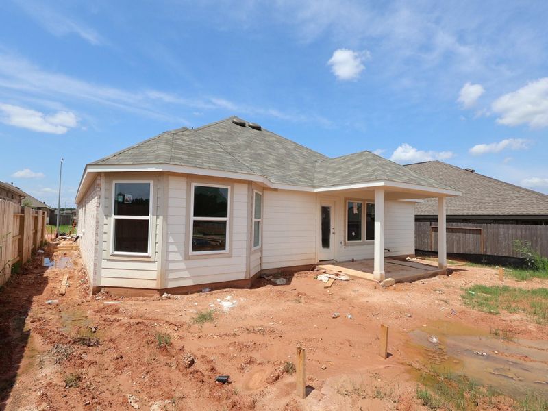 Front exterior of a new home in Magnolia Ridge, Magnolia, TX, highlighting curb appeal (Image 14).