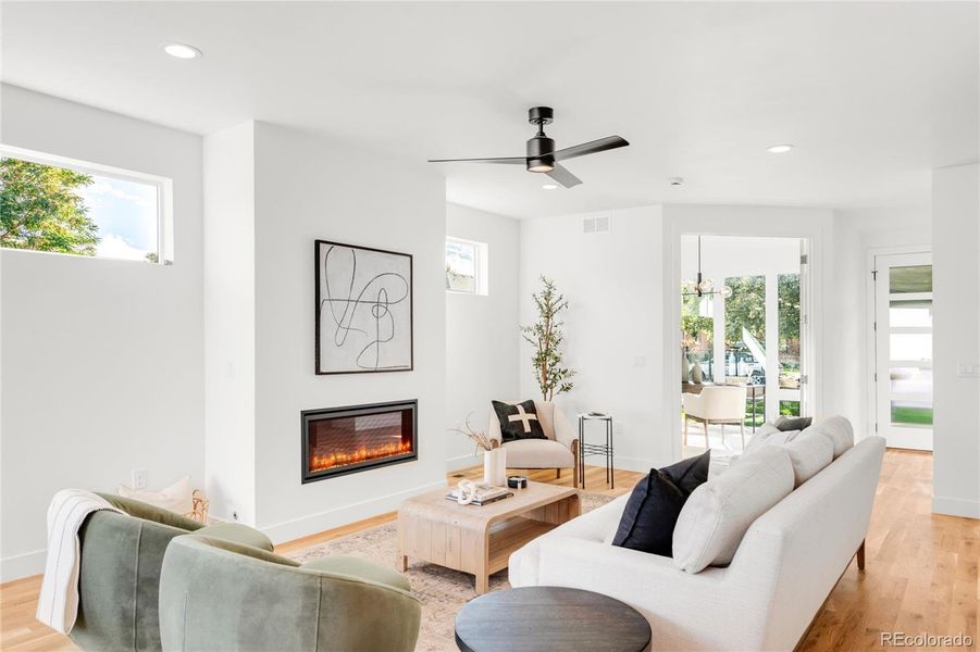 Living area toward front door and office