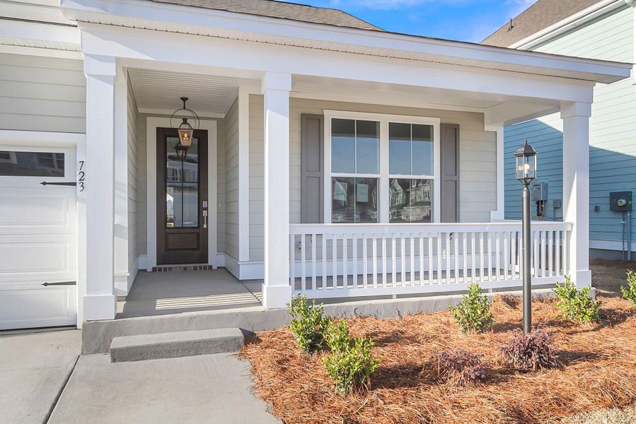Exterior details and patio area of a home in Tidewater at Lakes of Cane Bay, Summerville (Image 26).