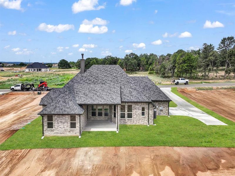 Front exterior of a new home in , Azle, TX, highlighting curb appeal (Image 19). Front exterior of a new home in , Azle, TX, highlighting curb appeal (Image 19).