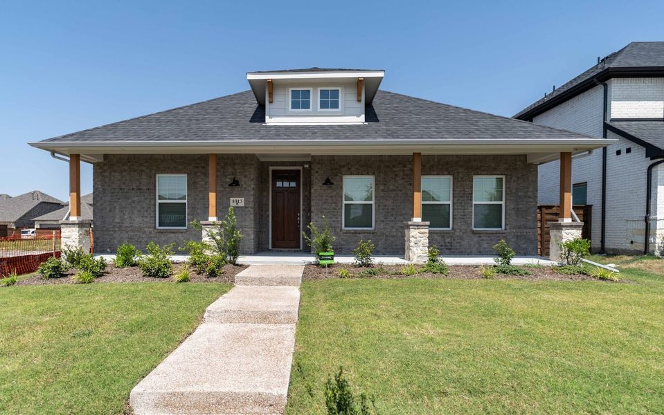 Front exterior of a new home in Solterra, Mesquite, TX, highlighting curb appeal (Image 1). Front exterior of a new home in Solterra, Mesquite, TX, highlighting curb appeal (Image 1).