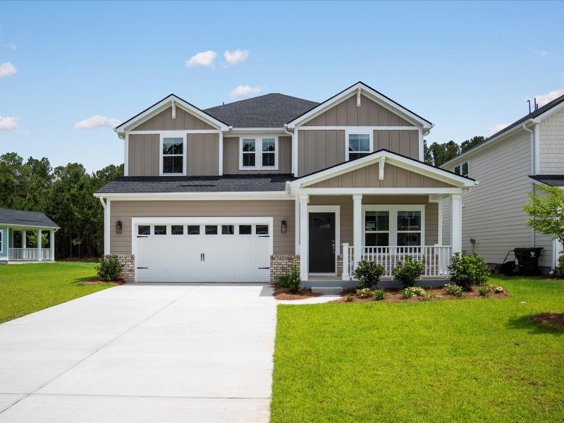 Front exterior of a new home in The Coves at Lakes of Cane Bay, Summerville, SC, highlighting curb appeal (Image 21).
