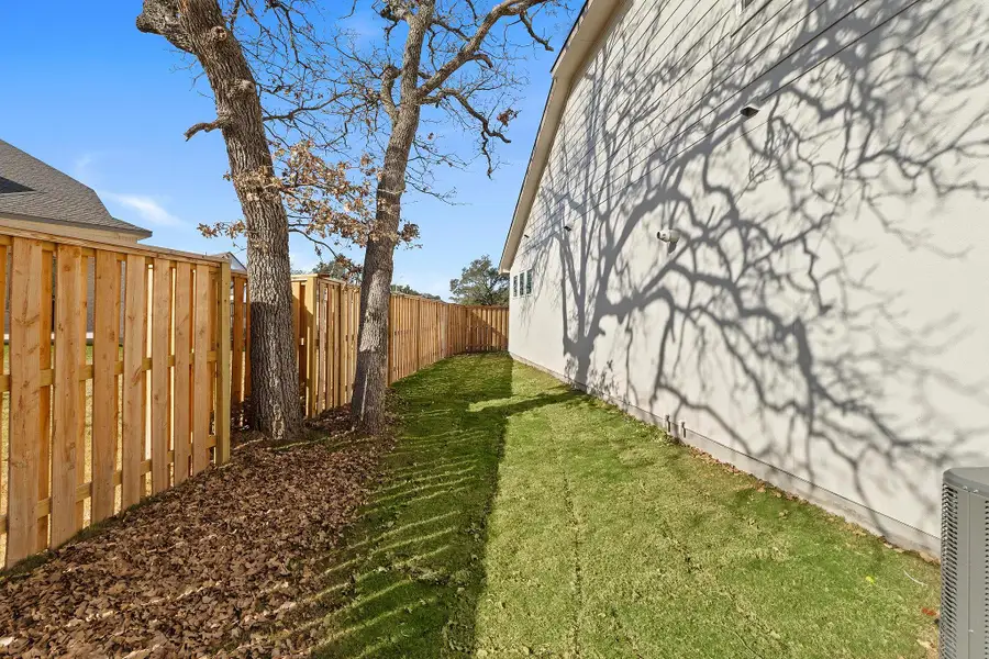 Exterior details and patio area of a home in Parmer Ranch, Georgetown (Image 26).