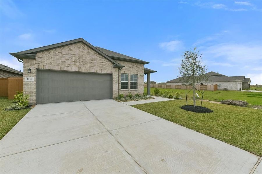 Front exterior of a new home in Emberly, Beasley, TX, highlighting curb appeal (Image 17). Front exterior of a new home in Emberly, Beasley, TX, highlighting curb appeal (Image 17).