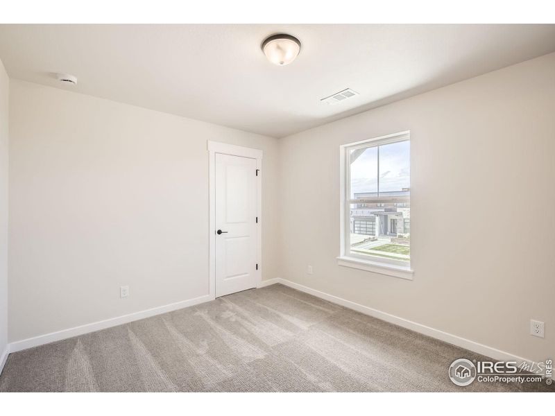 Spacious, unfurnished interior of a new home in RainDance National 60/70, Windsor (Image 16).
