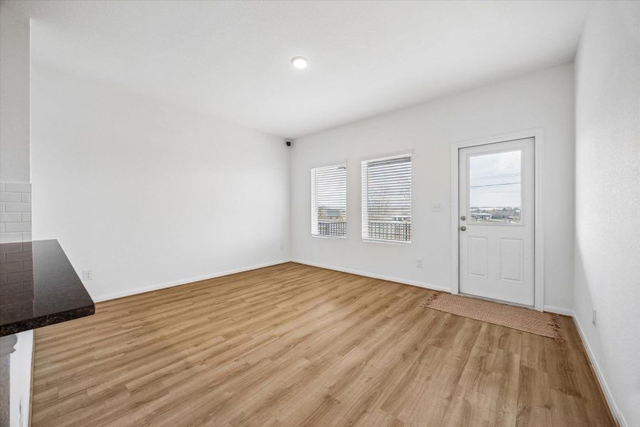 Entrance foyer featuring light wood-style floors and baseboards