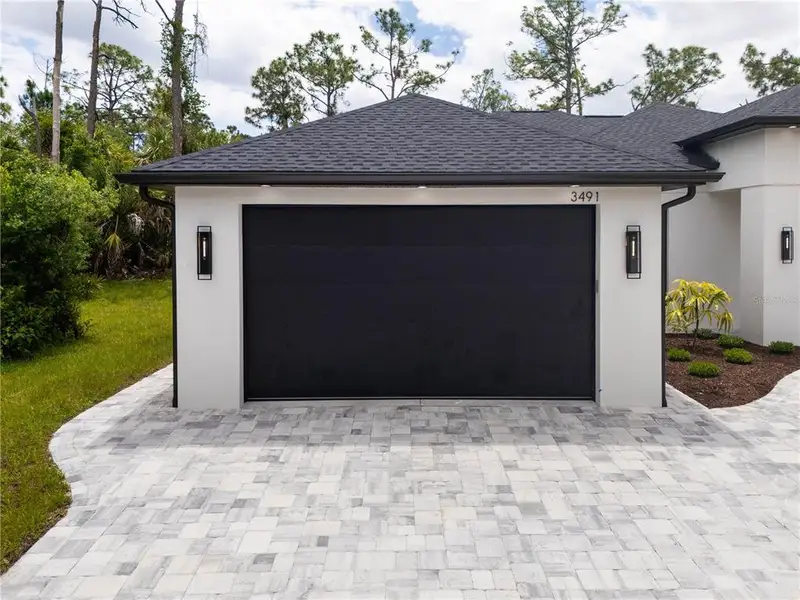 Front exterior of a new home in , North Port, FL, highlighting curb appeal (Image 33).