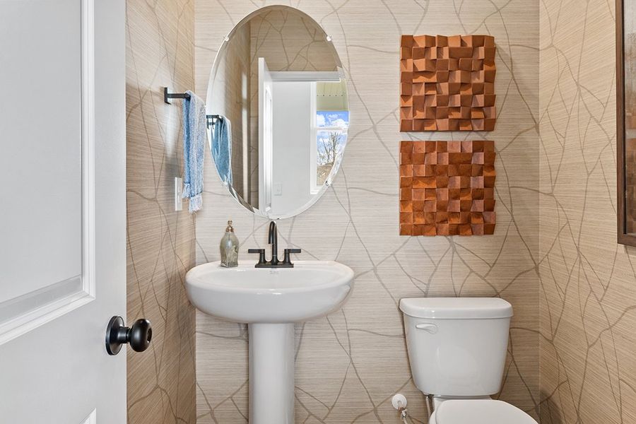 A bathroom with a sink and toilet.