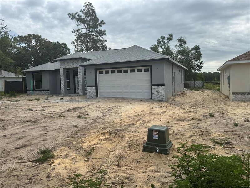 Front exterior of a new home in , Ocala, FL, highlighting curb appeal (Image 10).