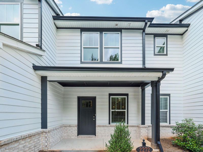 Front exterior of a new home in Avalon - Vista Series, Conyers, GA, highlighting curb appeal (Image 1).