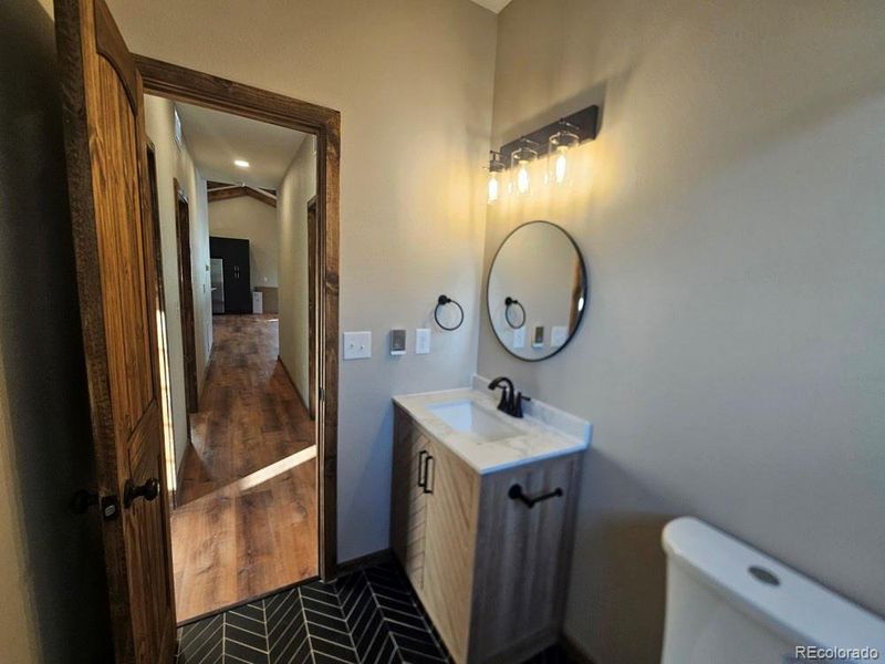 Full Secondary Bathroom at end of the Hall.