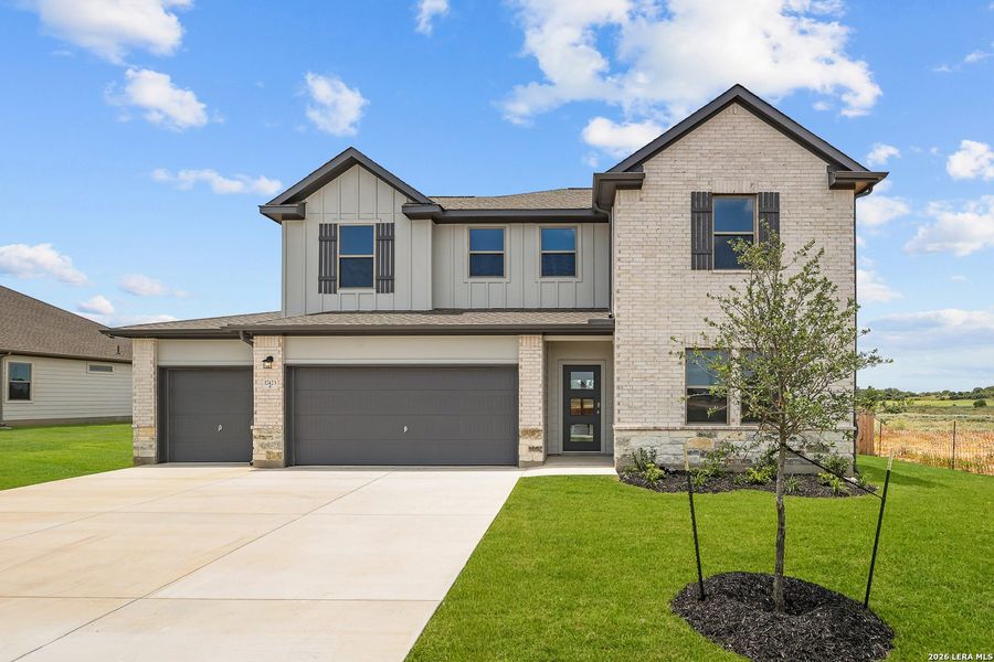 Front exterior of a new home in Hickory Ridge, Elmendorf, TX, highlighting curb appeal (Image 26). Front exterior of a new home in Hickory Ridge, Elmendorf, TX, highlighting curb appeal (Image 26).
