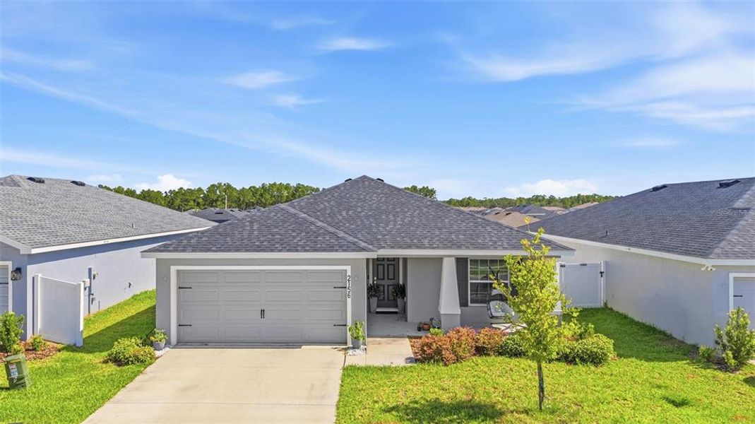 Front exterior of a new home in Astonia, Davenport, FL, highlighting curb appeal (Image 2). Front exterior of a new home in Astonia, Davenport, FL, highlighting curb appeal (Image 2).