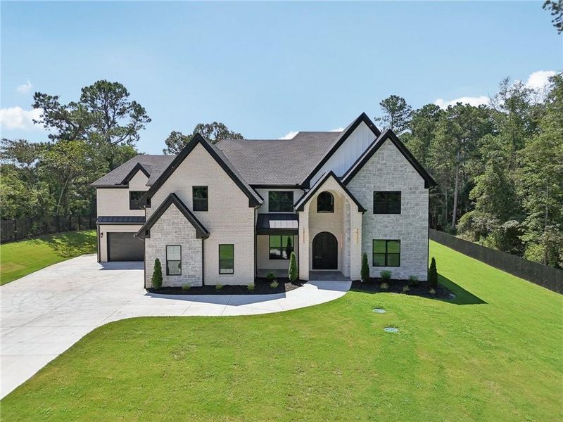 Front exterior of a new home in , Hoschton, GA, highlighting curb appeal (Image 28). Front exterior of a new home in , Hoschton, GA, highlighting curb appeal (Image 28).
