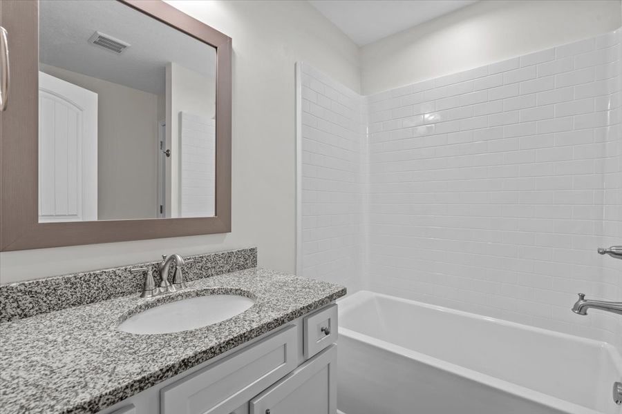 Representative furnished interior of a home built from the Fernwood by Enchanted Homes in Guadalupe Heights, Seguin (Image 9).