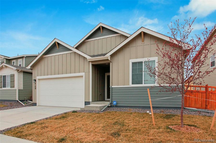 Front exterior of a new home in Brighton Crossings, Brighton, CO, highlighting curb appeal (Image 27).