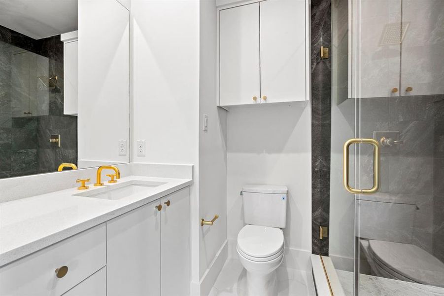 Bathroom with vanity and a stall shower Bathroom with vanity and a stall shower