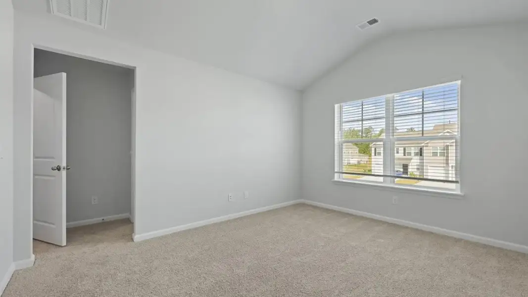 Spacious, unfurnished interior of a new home in Pine Hills Townhomes at Cane Bay, Summerville (Image 11). Spacious, unfurnished interior of a new home in Pine Hills Townhomes at Cane Bay, Summerville (Image 11).