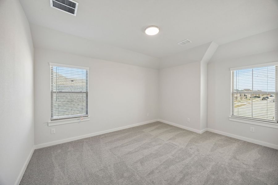 Bedroom in the Wimbledon home plan by Trophy Signature Homes – REPRESENTATIVE PHOTO