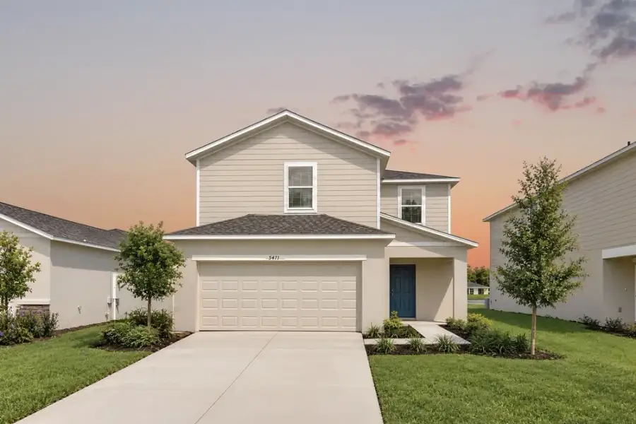 Representative exterior photo of a completed home built from the Dove by Taylor Morrison in Azure at Solaeris, Port St. Lucie, FL (Image 23).
