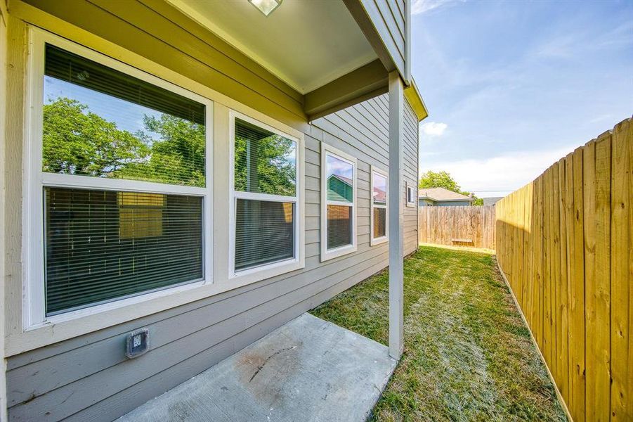 The small patio outside seamlessly leads to your backyard, providing an ideal space for relaxation. Its size is perfect for those with small pets or anyone who prefers a low-maintenance yard without the hassle of spending all afternoon mowing the lawn.