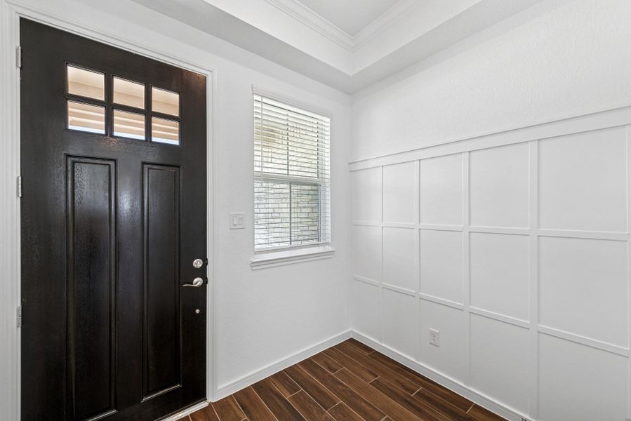 Welcoming foyer with feature wall
