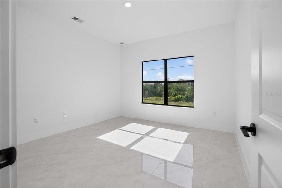 Spacious, unfurnished interior of a new home in , Port Charlotte (Image 49).