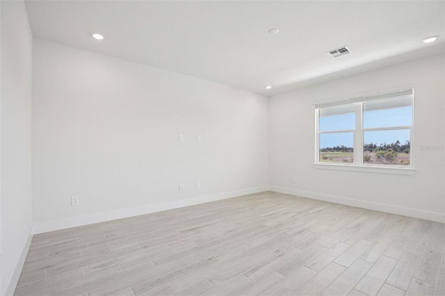 Spacious, unfurnished interior of a new home in Magnolia Bay - Reserve Series, Nokomis (Image 31).