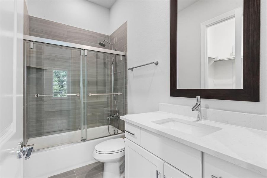 Private Bath to Bed 2. Note soft close glass sliding doors on shower!