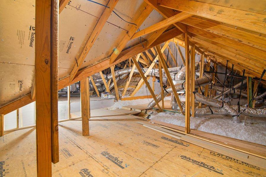 FThere is a walk up set up stairs in the garage to a large floored attic.