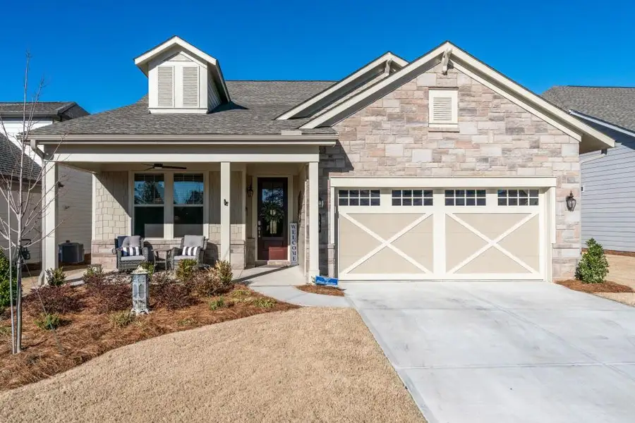 Front exterior of a new home in , Hoschton, GA, highlighting curb appeal (Image 23).