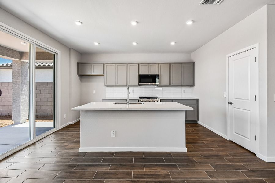 A kitchen with white cabinets. A kitchen with white cabinets.