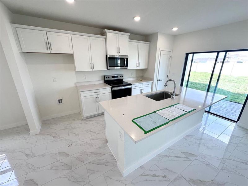 Furnished interior view inside a new home in Grasslands West, Lakeland (Image 10).