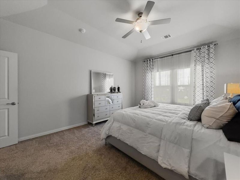 Bedroom featuring carpet and ceiling fan