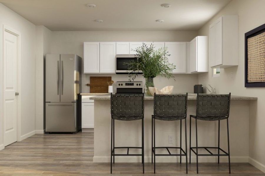 A kitchen with a table and chairs.