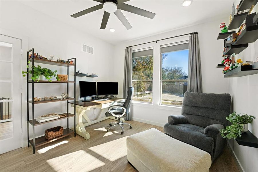 Office featuring wood finished floors and recessed lighting