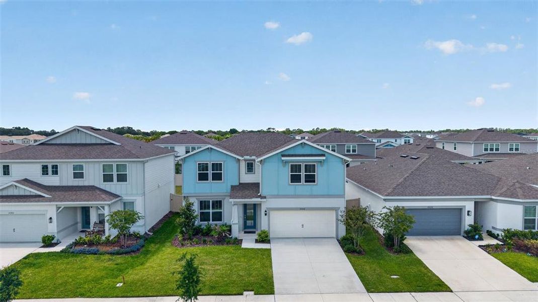 Front exterior of a new home in , St. Cloud, FL, highlighting curb appeal (Image 2). Front exterior of a new home in , St. Cloud, FL, highlighting curb appeal (Image 2).