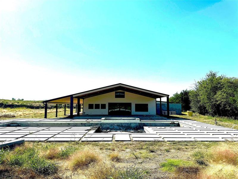 Rear view of house featuring a patio area