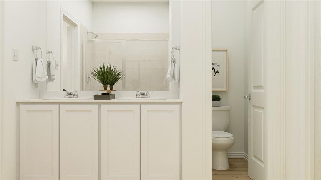 Bathroom with walk in shower, vanity, hardwood / wood-style floors, and toilet