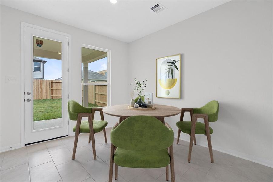 Start your day off right with a cup of coffee sitting with your family in the dining area! Featuring large window, access to your back yard, custom paint, tile flooring and recessed lighting.