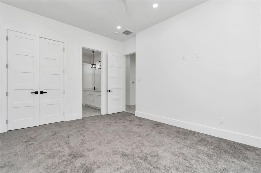 Charming guest suite with convenient Jack-and-Jill bath.