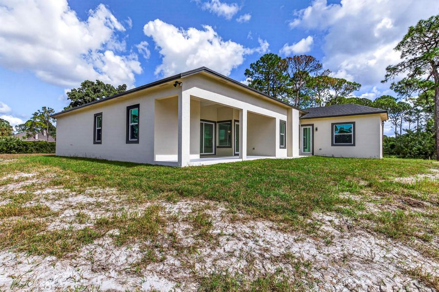 Exterior details and patio area of a home in , The Acreage (Image 31). Exterior details and patio area of a home in , The Acreage (Image 31).