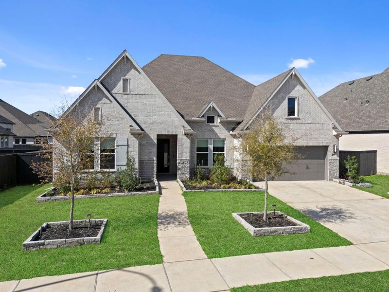 Front exterior of a new home in , Richmond, TX, highlighting curb appeal (Image 21).